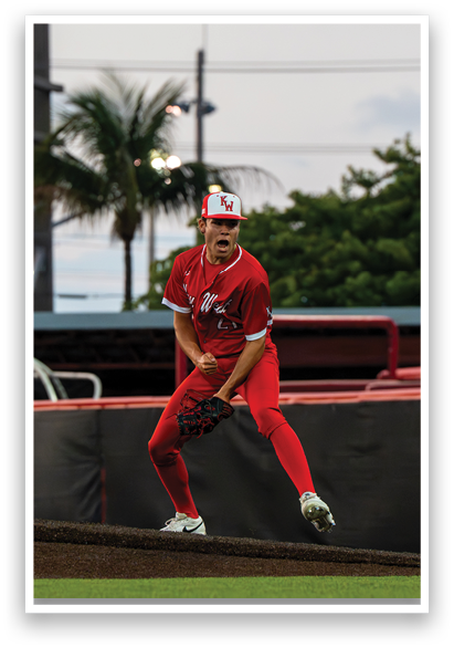 A baseball player in a red uniform is throwing a ball on a field. AI generated content