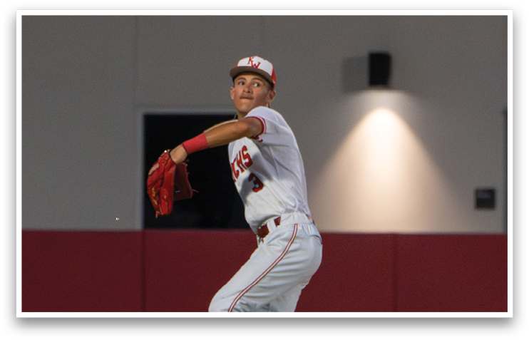 A baseball player in a white uniform is throwing a ball. AI generated content