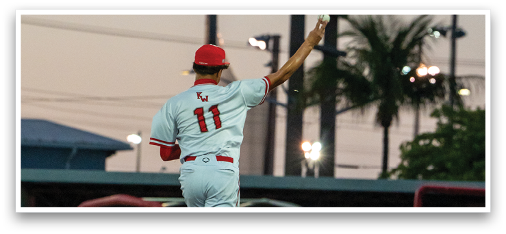 A baseball player is throwing a ball on the field. AI generated content