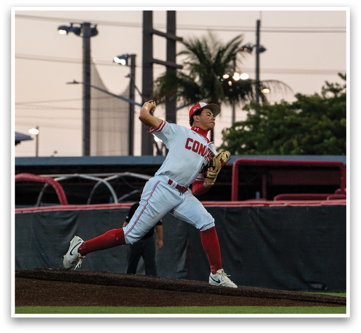 A baseball player in a white uniform is throwing a ball on a field. AI generated content