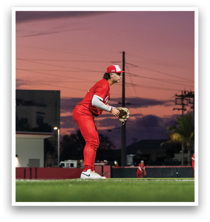 A baseball player in a red uniform is holding a mitt and waiting for a ball. AI generated content