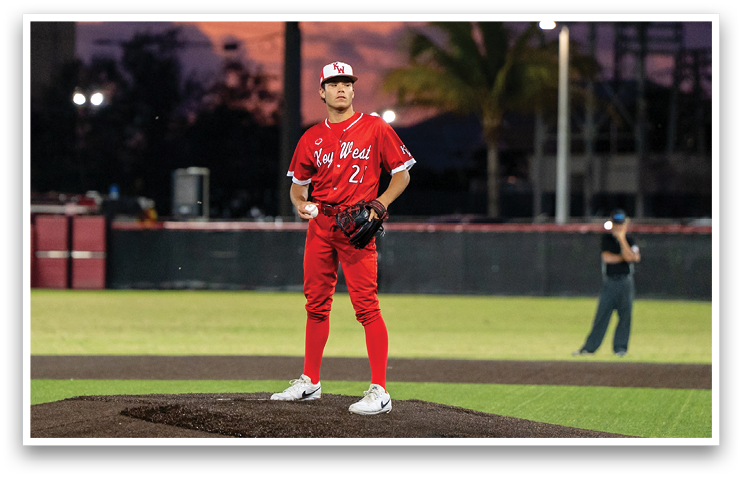 A man in a red baseball uniform stands on a pitcher's mound, preparing to throw the ball. AI generated content