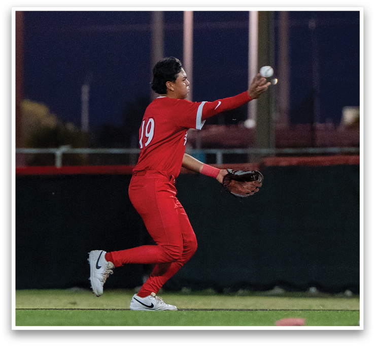 A baseball player in a red jersey is catching a ball with his glove. AI generated content