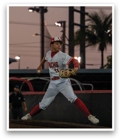 A baseball player in a white uniform is pitching a ball on a field. AI generated content