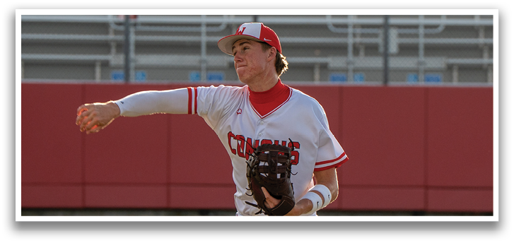 A baseball player in a white uniform is standing on a field, holding a baseball glove. AI generated content