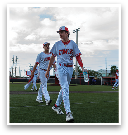 Two baseball players walking on a field, one holding a water bottle. AI generated content