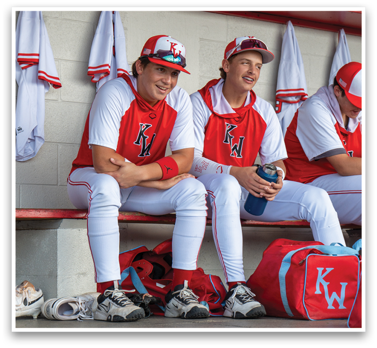 Two baseball players sitting on a bench, one with a water bottle. AI generated content