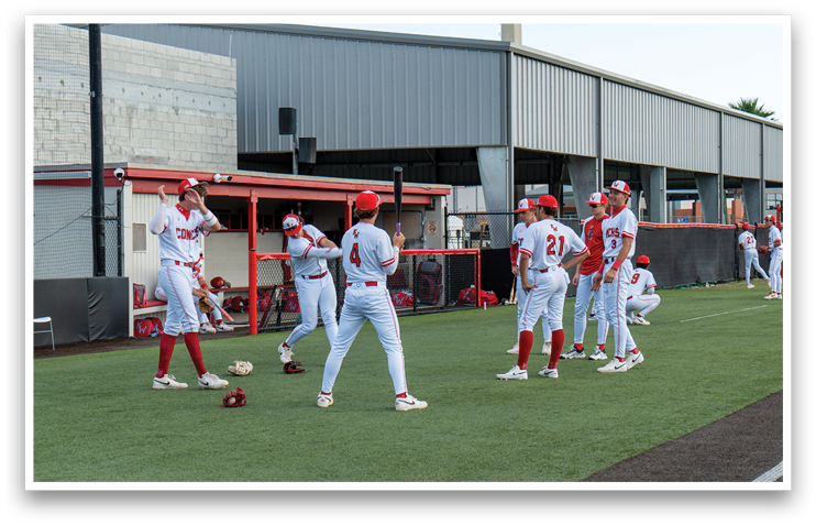 A group of baseball players wearing red and white uniforms are standing on a field. AI generated content