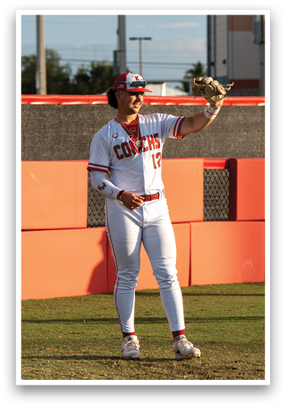A baseball player wearing a white uniform and a red hat is holding a baseball glove. AI generated content