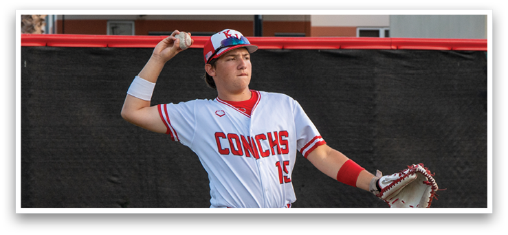 A baseball player in a white uniform is holding a baseball and preparing to throw it. AI generated content