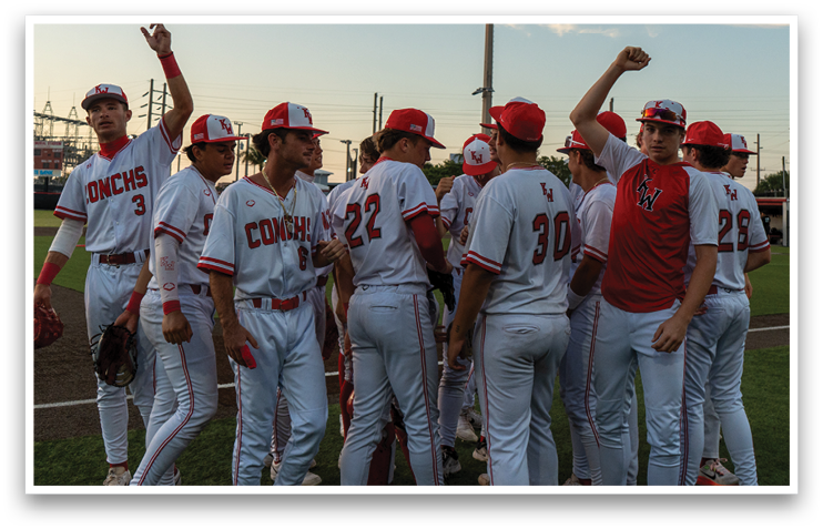 A group of baseball players wearing red and white uniforms are standing on a field. AI generated content