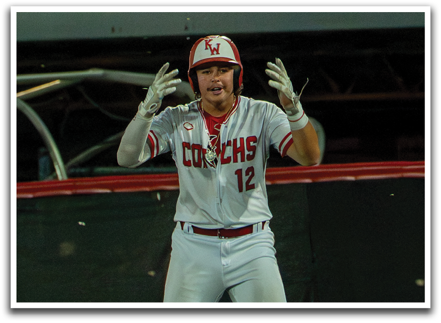 A baseball player wearing a white uniform with red trim and a red helmet stands on the field. AI generated content