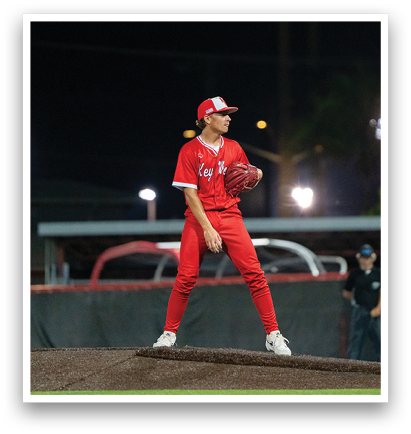 A baseball player in a red uniform is standing on the pitcher's mound, holding a ball in his hand. AI generated content