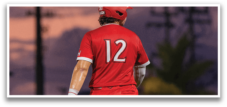 A baseball player wearing a red jersey with the number 12 walks on the field. AI generated content