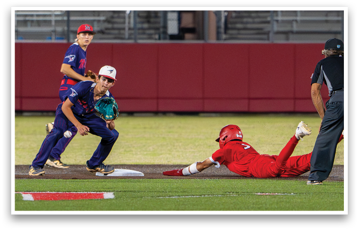 A baseball player in a red shirt and white shoes is swinging a bat. Description generated by AI