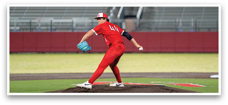 A boy in a red jersey is hugging a man in a red jersey. Description generated by AI