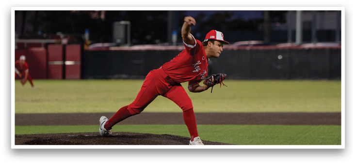 A boy in a red jersey is hugging a man in a red jersey. Description generated by AI