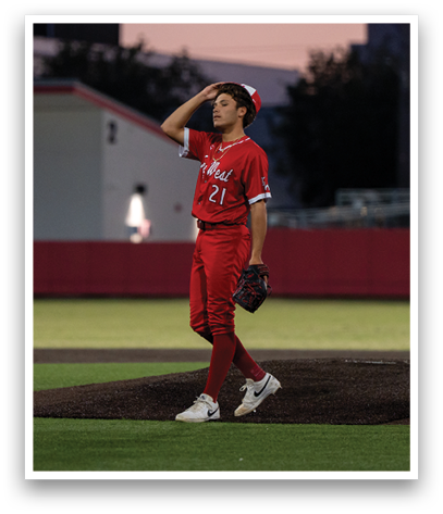 A baseball player in a red uniform is swinging a bat. Description generated by AI