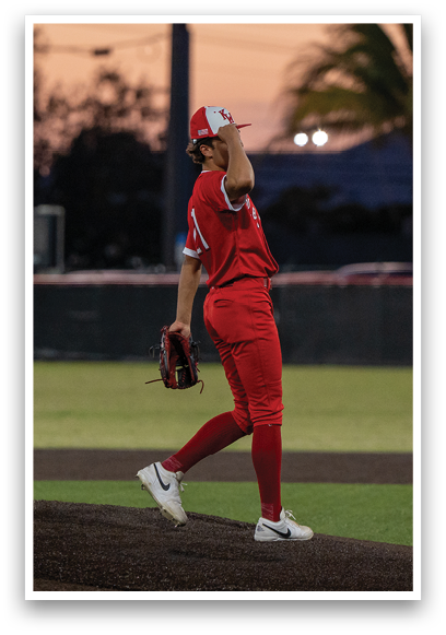 A baseball player in a red jersey is swinging a bat. Description generated by AI