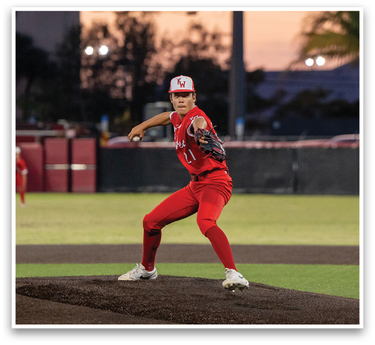 A baseball player in a red uniform is standing on a field. Description generated by AI