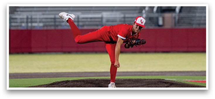 A boy in a red jersey is hugging a man in a red jersey. Description generated by AI