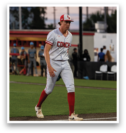 A baseball player wearing a red and white uniform. Description generated by AI