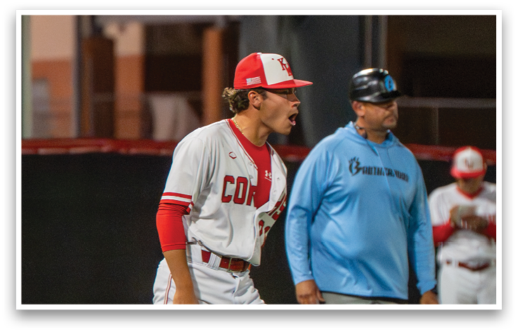 A baseball player wearing a red and white uniform. Description generated by AI