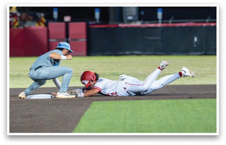 A baseball player slides into a base. Description generated by AI