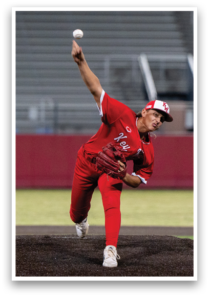 A baseball player in a red jersey is pitching a ball. Description generated by AI
