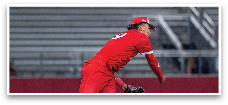A baseball player in a red uniform is throwing a ball. Description generated by AI