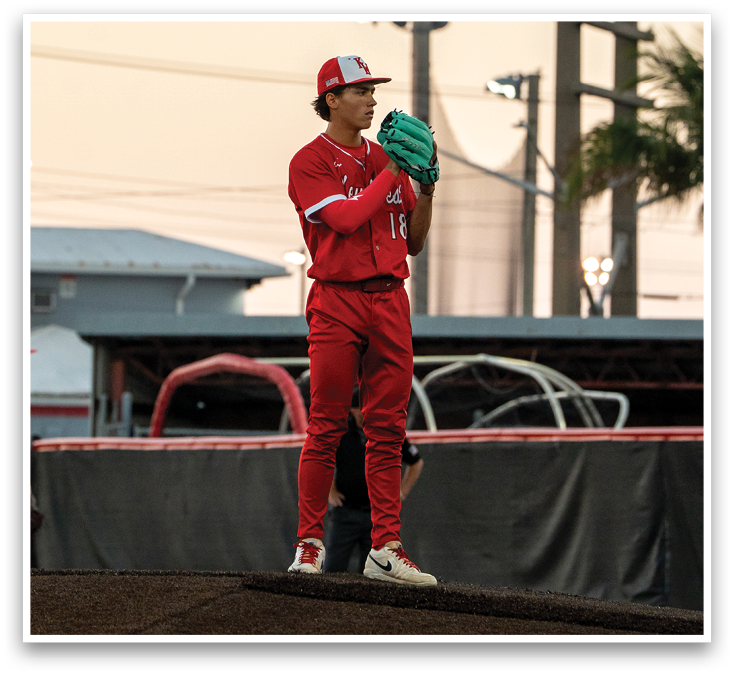 A baseball player wearing a red uniform and a green glove. Description generated by AI