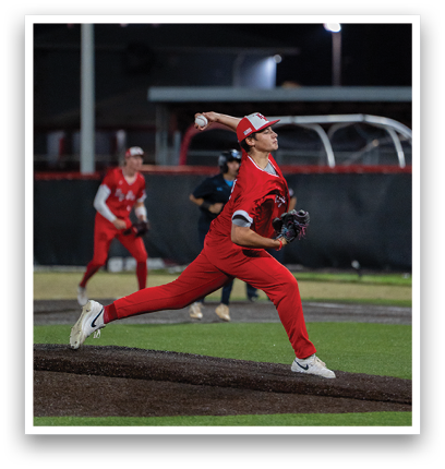 A baseball player in a red uniform is pitching a ball. Description generated by AI