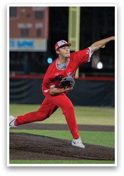 A baseball player in a red uniform is pitching a ball. Description generated by AI
