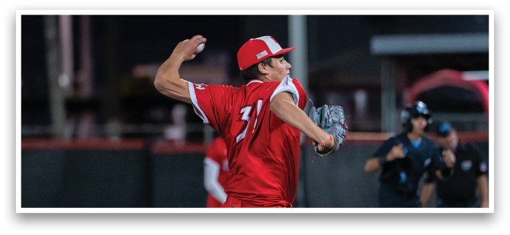 A baseball player in a red shirt and red pants is throwing a ball. Description generated by AI