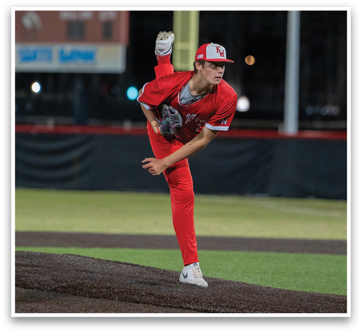 A baseball player in a red uniform is pitching a ball. Description generated by AI