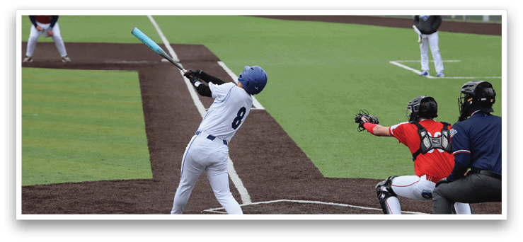 A baseball player is swinging a bat, attempting to hit the ball. The catcher is positioned behind him, ready to catch the ball if the batter misses. AI generated content