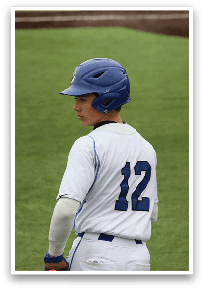 A baseball player wearing a blue helmet and white uniform is walking on the field. AI generated content