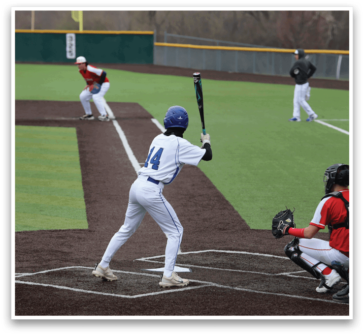 A baseball player is at bat, holding a bat and preparing to swing. The catcher is positioned behind him, wearing a baseball glove. There are other players on the field, some of them holding baseball bats. The scene is set on a baseball field. AI generated content