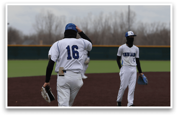 Two baseball players are standing on a field, one of them wearing a blue hat. AI generated content