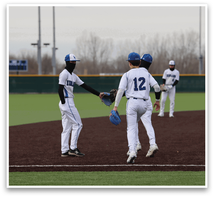 Three baseball players are on a field, one of them wearing a blue and white uniform with the number 12. They are holding their gloves, ready to play. AI generated content