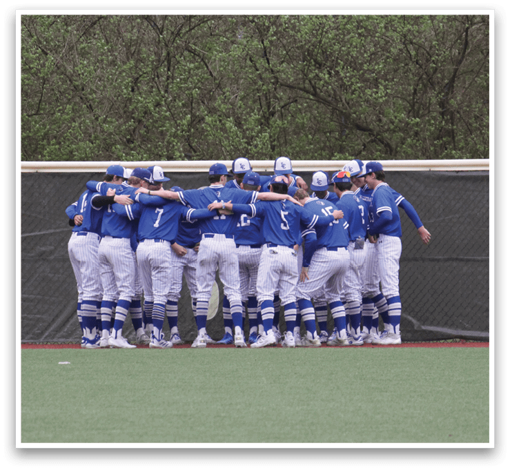 A group of baseball players huddle together on the field, wearing blue and white uniforms. AI generated content