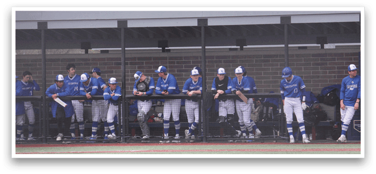 Baseball players in blue uniforms are standing in a line on a baseball field. AI generated content