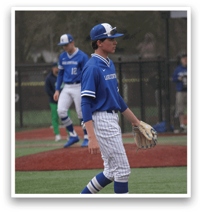 A baseball player wearing a blue uniform is holding a baseball glove and standing on the field. AI generated content