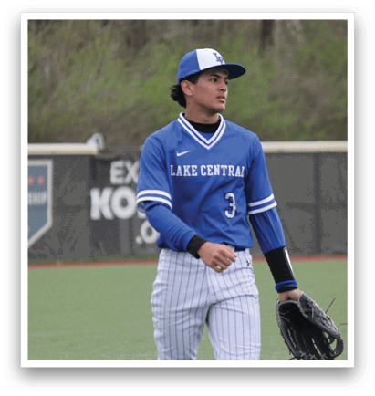 A baseball player wearing a blue and white uniform stands on a field with a baseball glove in his hand. AI generated content