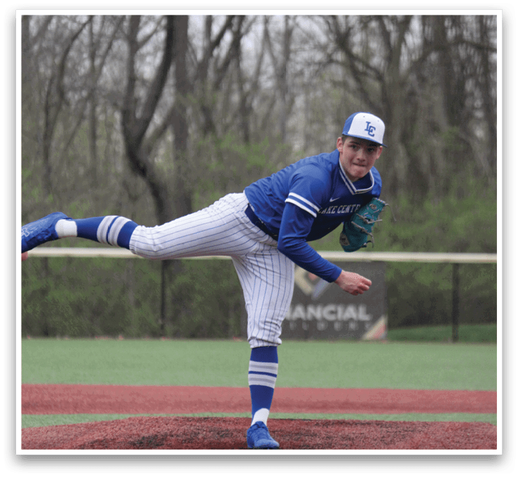 A baseball player in a blue uniform is in the middle of a pitch, with his leg in the air. AI generated content