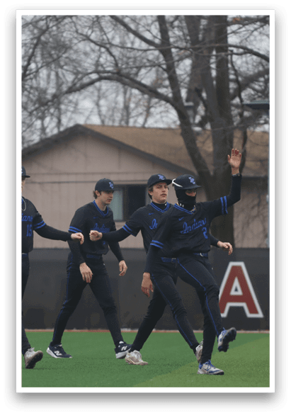 A group of men wearing black and blue uniforms are standing on a field. AI generated content
