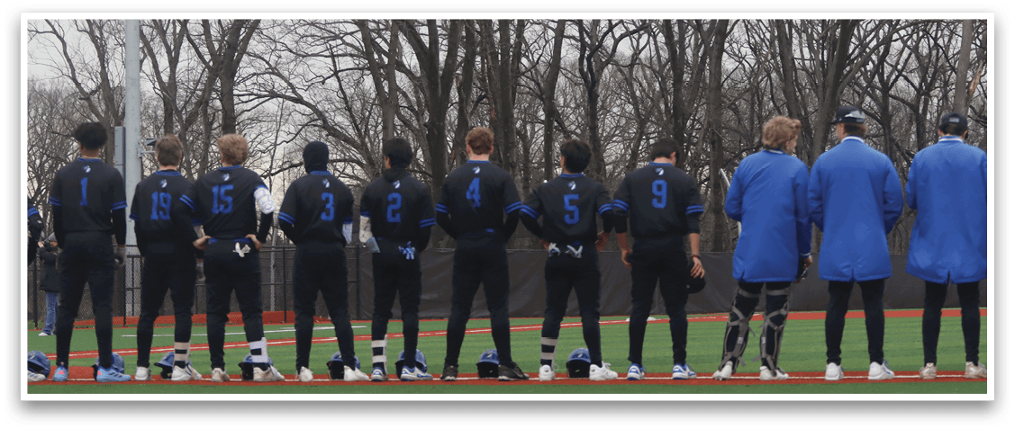 A group of baseball players wearing blue and black uniforms are standing on a field. AI generated content