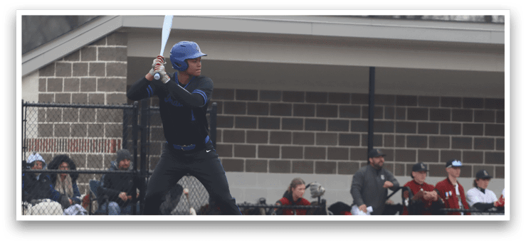A baseball player in a blue helmet and black uniform is holding a bat, preparing to swing. AI generated content