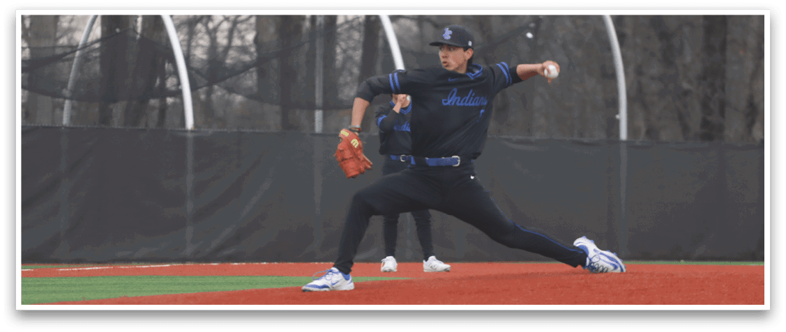 A baseball player in a black shirt and blue hat is pitching a ball on a field. AI generated content