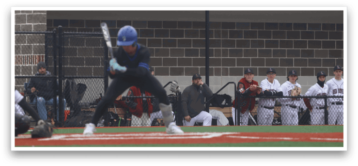 A baseball player in a blue helmet is swinging a bat at a ball. AI generated content